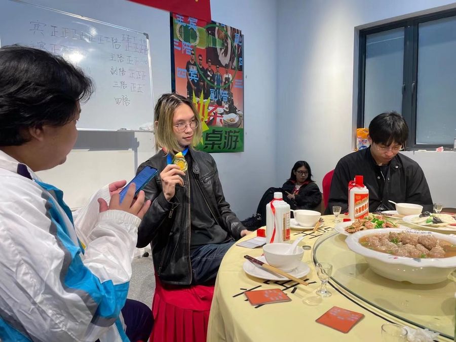 An MVP at the game demo shows off his medal.