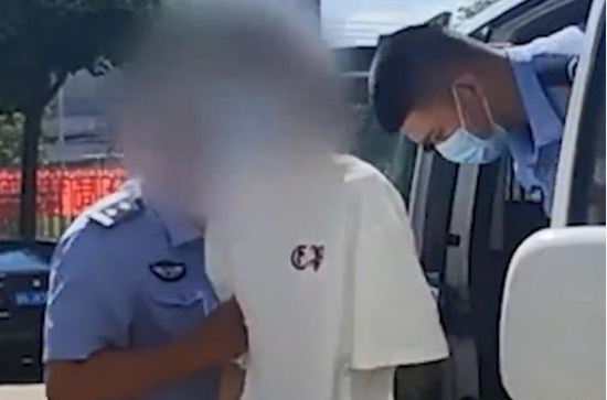 Police taking another suspect into custody