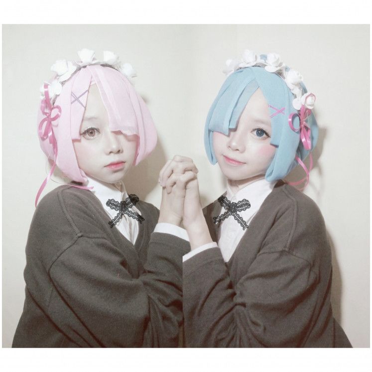 Photo of a Hijab cosplayer cosplayed Rem and Ram.