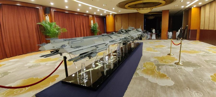 A photo shows a huge UEES Retribution dreadnought model in the event.